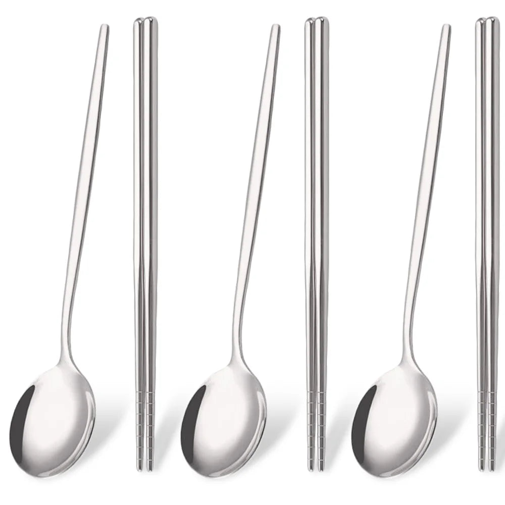 A set of six stainless steel Korean dinnerware pieces including spoons and chopsticks.