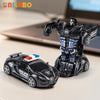 A black transformable robot sports car toy and its corresponding robot figure are displayed on a light surface.