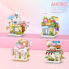 A set of mini city shop building blocks featuring various themed shops like a cat cafe, a fruit shop, and a candy store.