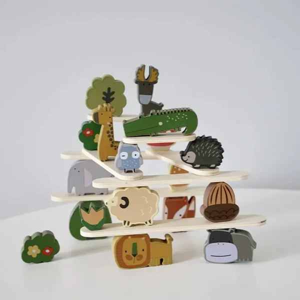 A stack of wooden animal blocks featuring various woodland creatures like a deer, hedgehog, and owl.