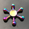 A rainbow metal fidget spinner with smooth silent rotation, featuring multiple iridescent, polished metal blades.