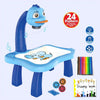 A blue kids drawing projector with a curved arm, featuring a tablet and a set of colored pencils and a drawing book.