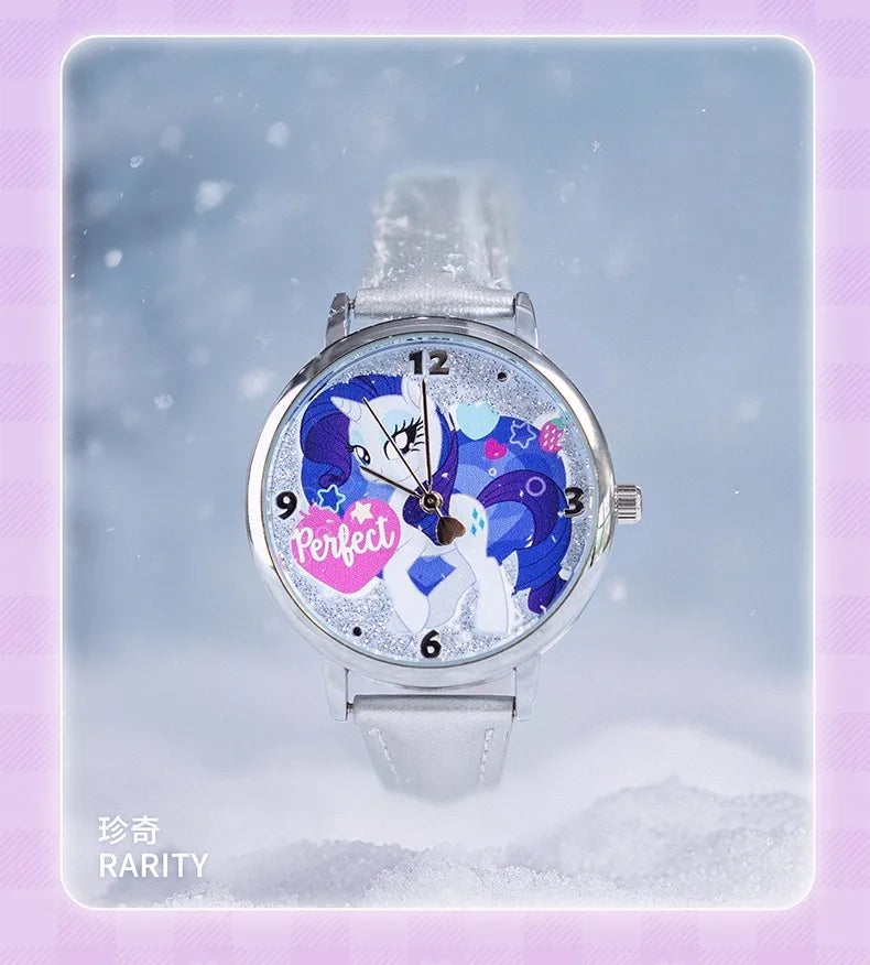 A silver watch featuring a colorful My Little Pony design on the face and a silver band, photographed against a snowy backgro