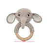 A light beige elephant wooden baby rattle and teether ring.