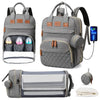 Gray multifunctional diaper bag backpack featuring a changing pad and USB port, shown with an attached changing mat.