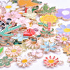 Assortment of gold-tone enamel charms featuring various floral shapes and colors for jewelry making