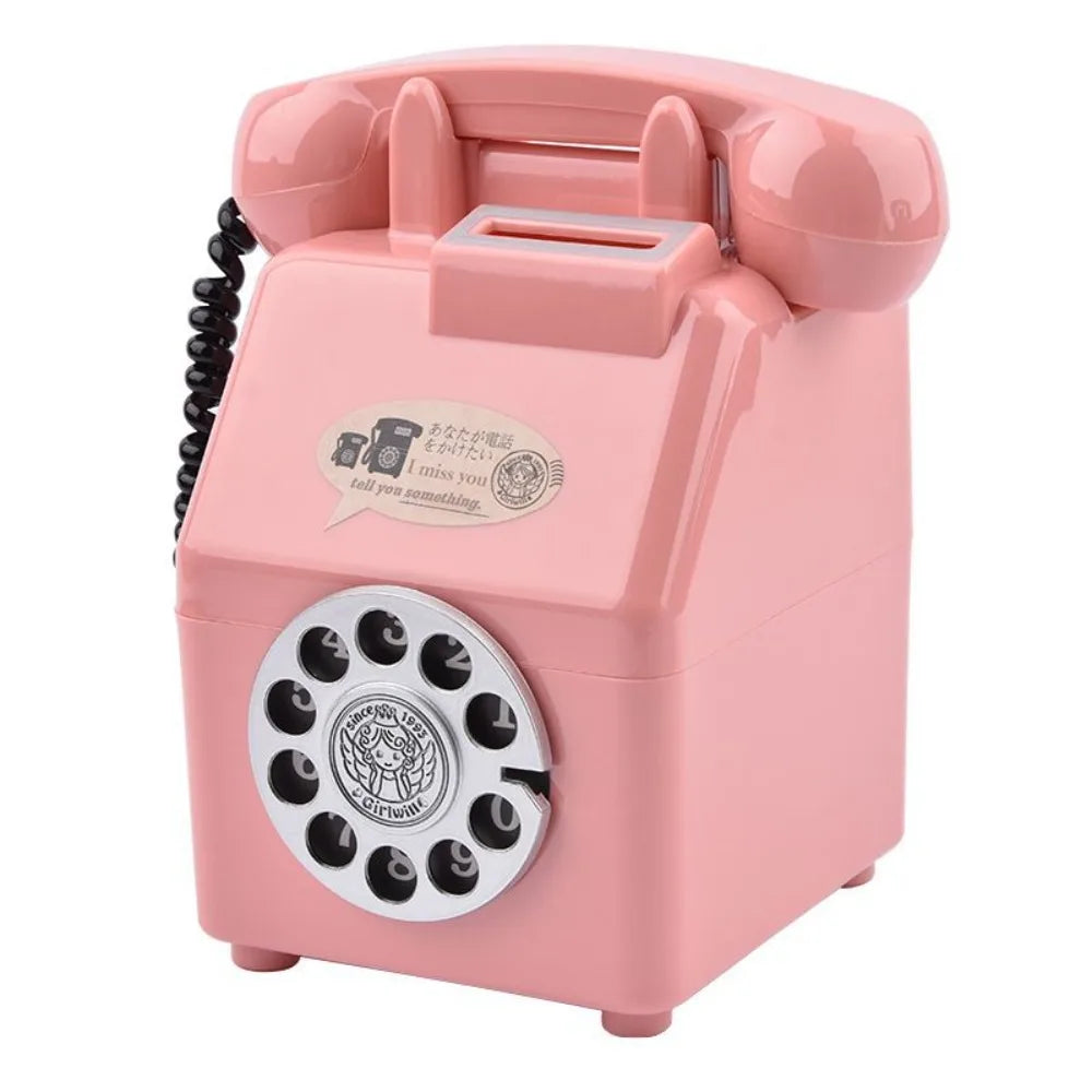 A pink vintage rotary telephone piggy bank with a coin slot and bill slot.
