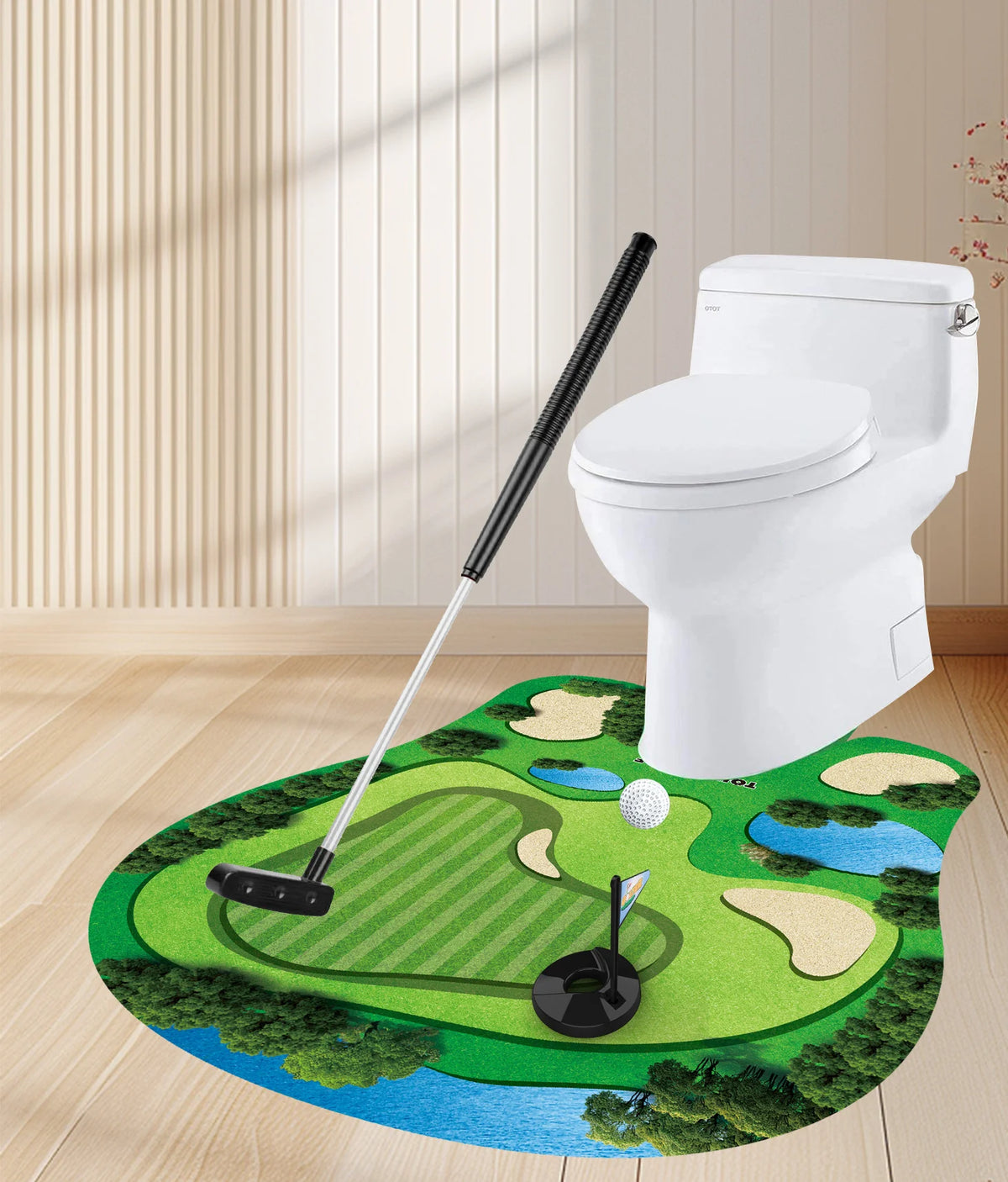 A white toilet, a black putting practice set with mat, putter, and balls, placed on a green putting surface.