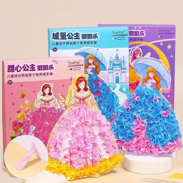 A colorful fabric art craft kit featuring a pink and yellow princess dress and an umbrella in a box.