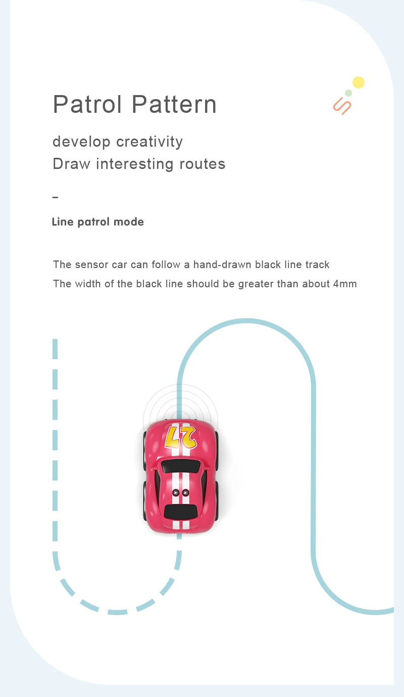 A pink sensor car is following a hand-drawn black line on a white surface.