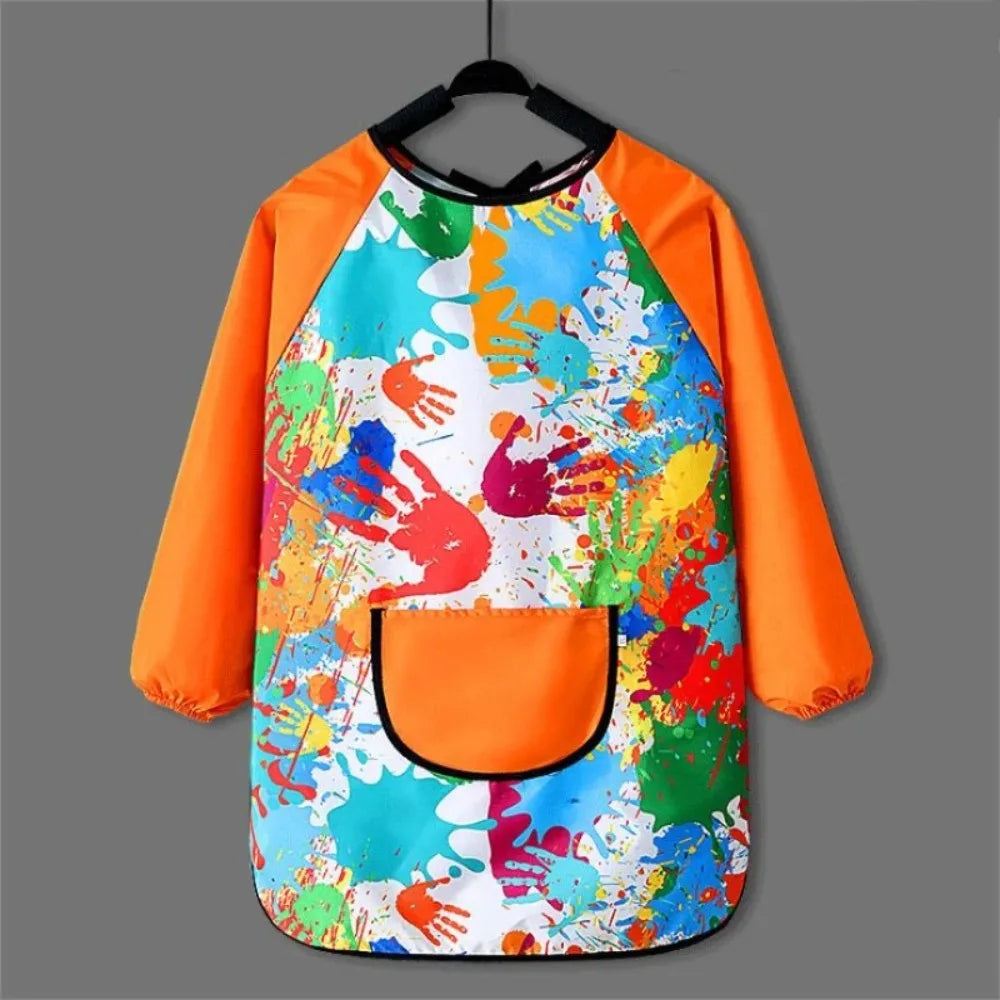 Kids waterproof long-sleeve art smock and dining bib featuring a colorful paint splatter design