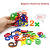 A hand holds a bag of magnetic numerical symbols including numbers and symbols for learning.