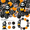 A set of 25 Halloween silicone beads featuring skulls and bats in black, orange, and yellow colors.