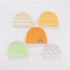 Five knitted baby hats in yellow, orange, green, and striped colors displayed on a white background.