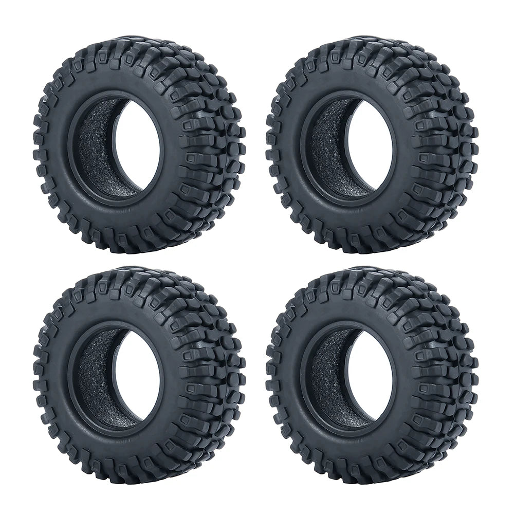 Un jeu de roues en caoutchouc souple noir pour voitures télécommandées crawler.