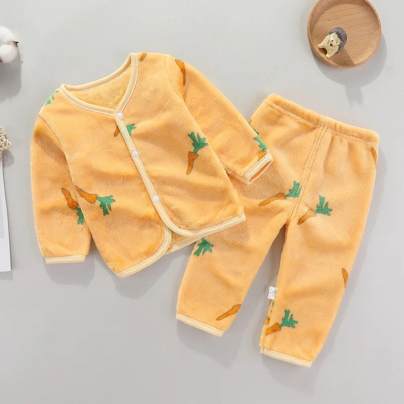A yellow fleece jacket and pants set for a baby with a cartoon print of carrots.