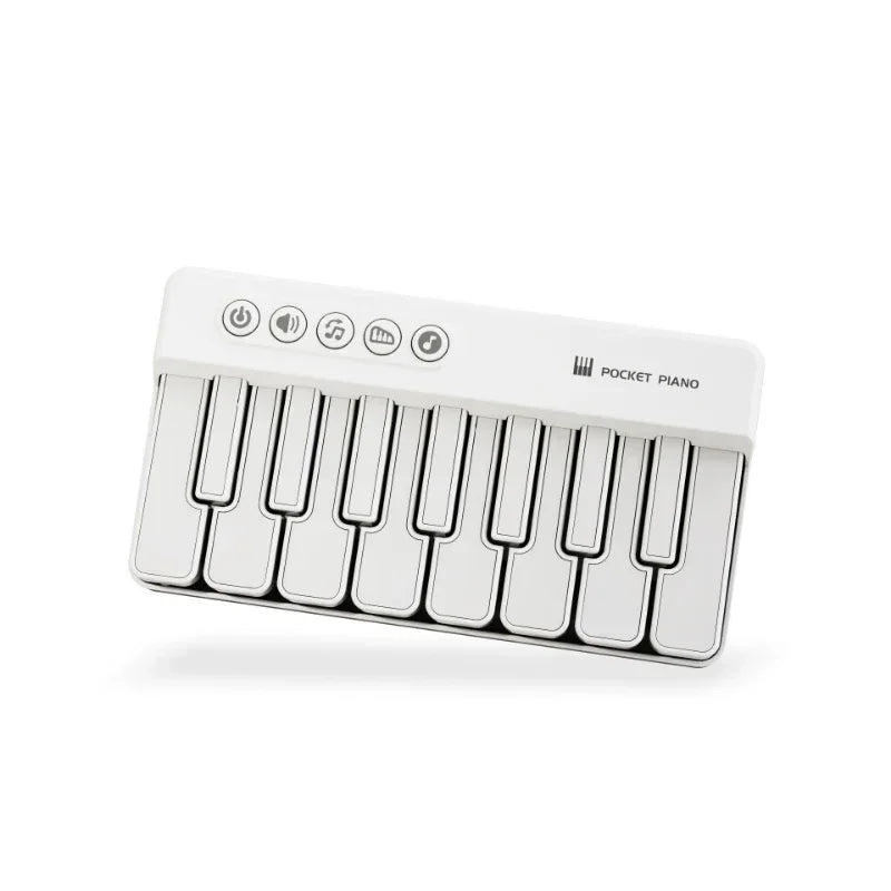 A white 7-key mini electronic keyboard piano with indicator lights.