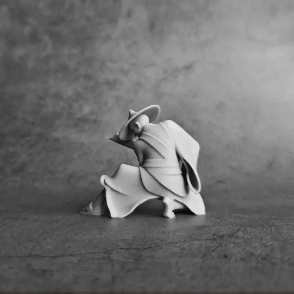 A black and white photograph of a 3D printed samurai warrior figurine statue.