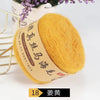 A ball of bright yellow mohair yarn labeled South African mohair for knitting projects.