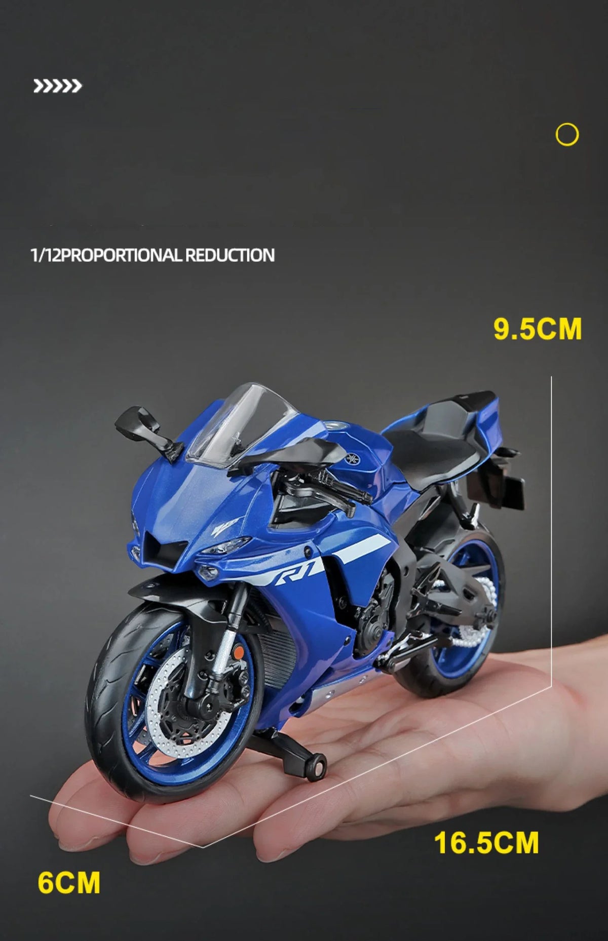 A blue 1:12 scale diecast model of a Yamaha YZF-R1M motorcycle is shown being held in a hand.
