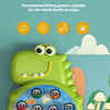 A green dinosaur-shaped magnetic fishing toy with various colored fish and prey figures.