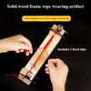 Hands are weaving a red rope through a wooden frame using fixed clips to create an artifact.