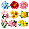 A collection of multi-flower silicone molds in various shades of blue, red, pink, and yellow for crafting.