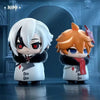 Two chibi figurines of Fatui Harbingers, one white-haired and one orange-haired, displayed against a dark blue background.
