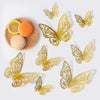 Gold rose gold 3D butterfly wall stickers displayed on a white background.