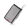 A gray portable baby changing mat with a storage bag and drawstring closure.