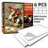 A box of a 1000-piece jigsaw puzzle featuring a painting of Napoleon crossing the Alps with included adhesive paper sheets.