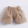 Shorts en jean couleur sable pour accessoires de poupée avec poches visibles et bords effilochés