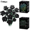 A bouquet of dark black roses made from building blocks, packaged in a box.