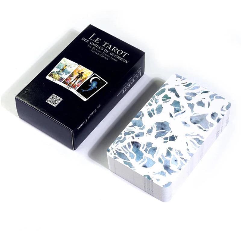 A black box of the Le Tarot des Vagues de Guérison deck is shown next to an open box displaying cards.