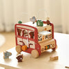 A red wooden animal tourism bus Montessori busy board for toddlers with various wooden components.