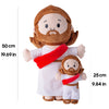 A plush toy of Jesus with a beard and brown hair wearing a white robe and a red sash, accompanied by a smaller Bible companio
