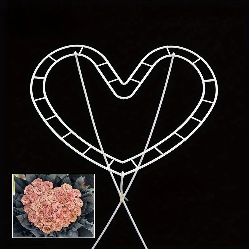 White wire heart shape flower holders for DIY bouquets with a small pink rose in the center.