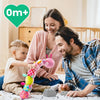 A smiling mother and son play with a soft musical rattle caterpillar plush toy in a bright indoor setting.