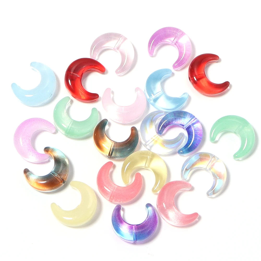 A collection of iridescent moon-shaped glass beads in various shades of pink, purple, blue, and green.
