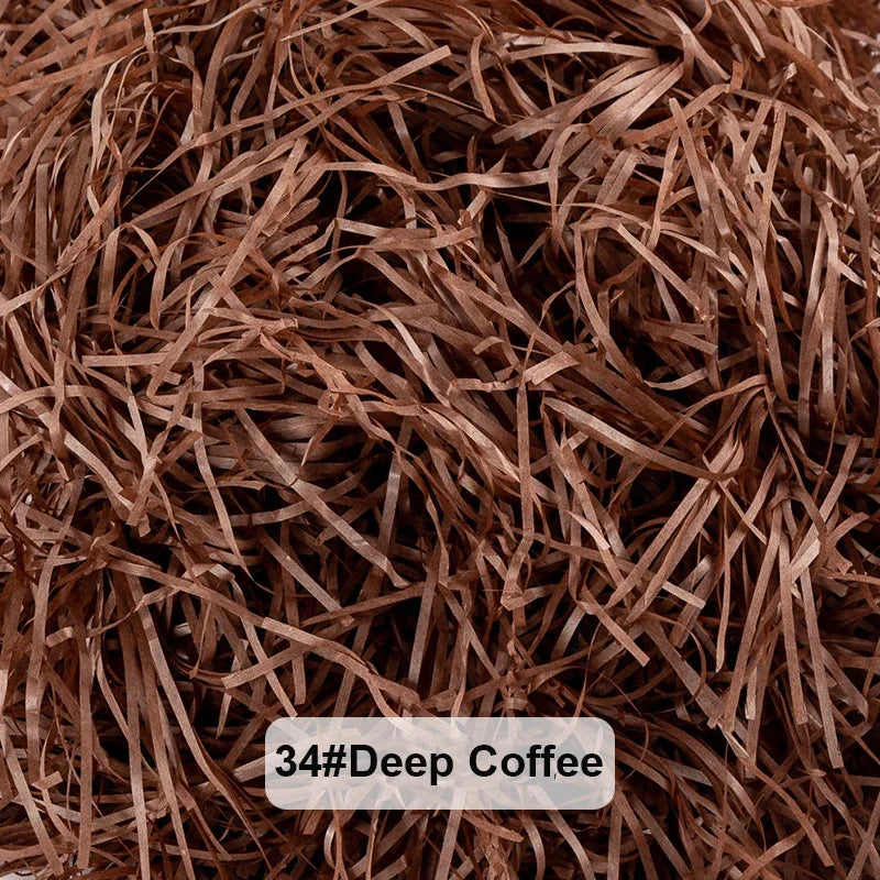 A close-up view of dark brown raffia paper shreds used for gift boxes and baskets.