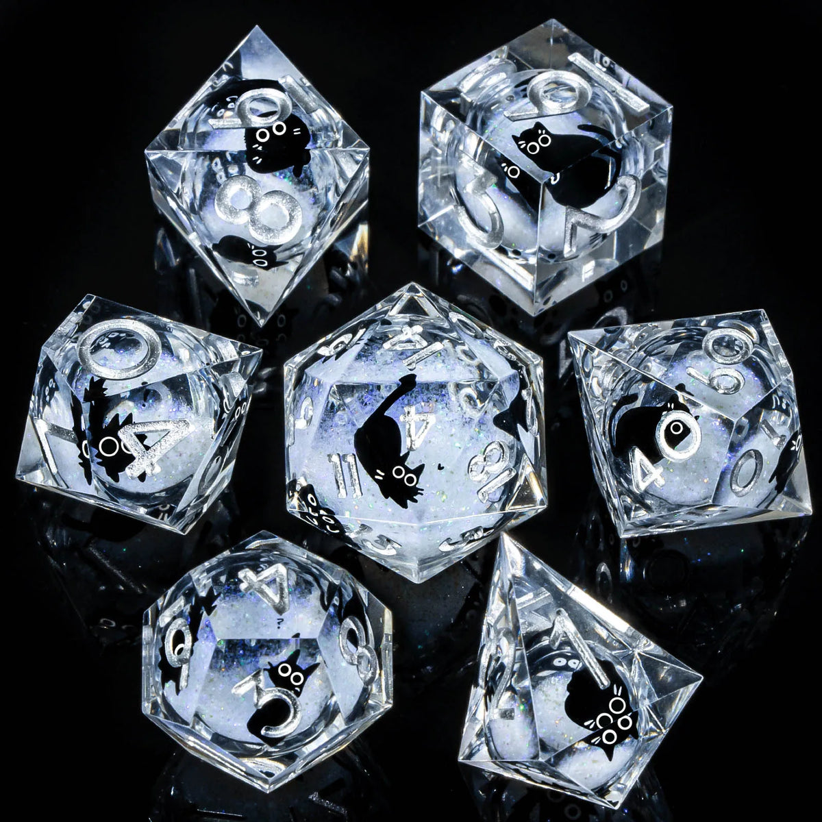 A set of clear, faceted resin dice shaped like tetrahedrons and dodecahedrons for tabletop role-playing games
