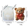A silicone candle mold shaped like a teddy bear hugging a heart, used for DIY crafts.