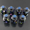 A set of seven floral resin potion bottle polyhedral dice, numbered 4, 6, 10, 12, 20, and 100.