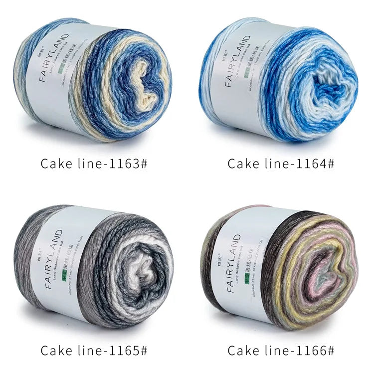 Four skeins of gradient rainbow cotton-wool yarn in various shades and textures for knitting and crochet projects