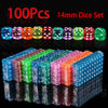 A collection of 100 transparent acrylic 6-sided dice in various colors and patterns displayed on a reflective surface.