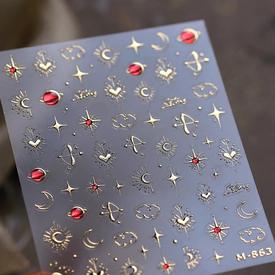 A sheet of 5D bronzing gothic nail art stickers featuring various celestial and decorative symbols.
