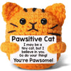 An orange crocheted cat figurine with black stripes, expressing a positive message.