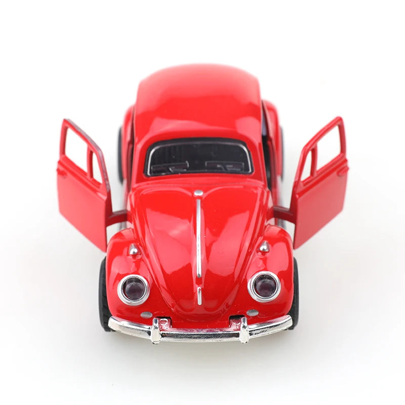 A bright red 1:38 die-cast model of a classic Beetle car.