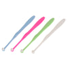 A set of four orthodontic interdental brushes in blue, pink, green, and white.