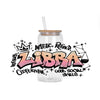 A clear glass bottle with a straw contains liquid and features graffiti art for the Libra zodiac sign.